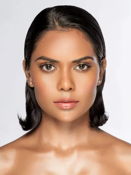 A classic beauty shot. The clean, even lighting and direct gaze make this a perfect headshot for a model's portfolio or a skincare campaign.