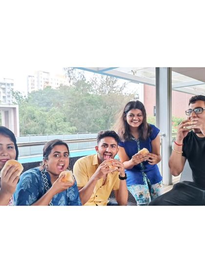 A duplicate of the whole group enjoying some vada pav. Food tours are a big part of our city explorations.