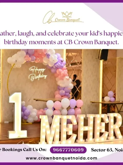 A first birthday celebration setup featuring a large light-up number '1' and name. The pastel balloon arch against a mirrored wall creates a modern and stylish look.