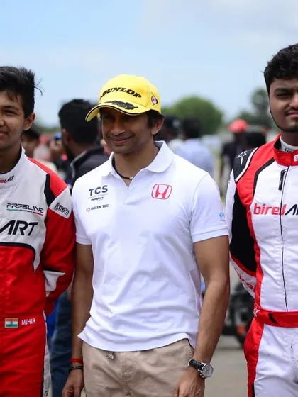 Two of our drivers posing with Narain Karthikeyan, gaining invaluable insights from one of India's most successful racers.