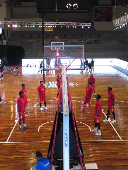 A team runs through shooting drills on our main court. The professional setup, including the polished wooden floor and clear court markings, provides an ideal environment for focused practice.