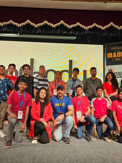 A group photo of the WMC team and performers with the event organizers at Madfit 2023.