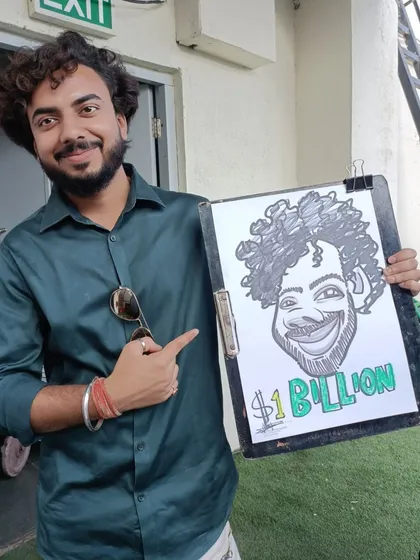 A guest pointing to his caricature, which has '$1 Billion' written on it. I'm always up for fun and creative ideas.