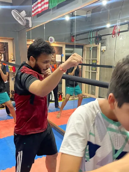 This is how we build awareness: 'ए भाई ज़रा देखके चलो'. In our group classes, we practice defensive movements and shadow boxing to stay sharp and alert from all angles.