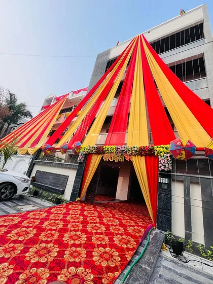 Another angle of the grand tent entrance, showing the red carpet walkway leading into the venue. It makes guests feel special from the moment they arrive.