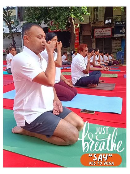 A moment of collective pranayama during an outdoor event. It's a powerful image of our community breathing together, finding calm and focus in unison.