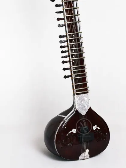 A full-length view of a classic Ustad Vilayat Khan style sitar. Its sleek design is built for a specific tonal quality, favored by many professional musicians.