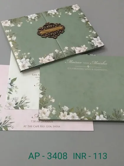 This simple yet elegant gate-fold card in sage green is adorned with white flowers. It's an affordable option that doesn't compromise on style, perfect for a garden or daytime wedding.