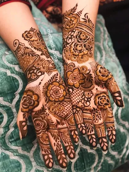I love creating modern floral mehandi designs. This style uses bold rose patterns and delicate linework, perfect for a sangeet, engagement, or for a bride who wants a contemporary look.