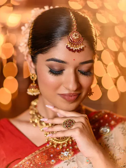 Another detailed shot, focusing on the beautiful maang tikka and the perfectly defined eyes.