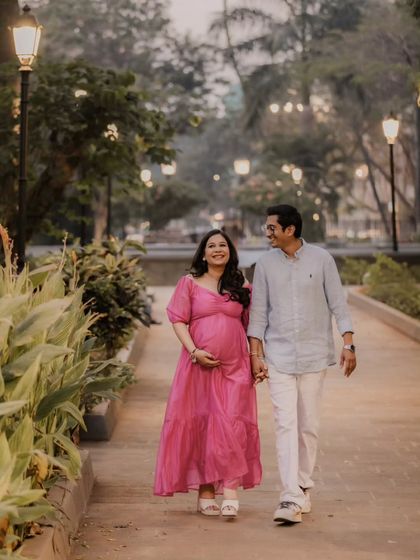 A candid shot of the couple walking through the park. Their shared smile and easy stride show their comfortable love story. This is the kind of natural, storytelling photography I aim for, even in a planned session.