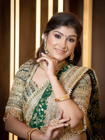 A close-up portrait that captures her elegance. The soft contouring and glowing skin are hallmarks of my signature bridal style.