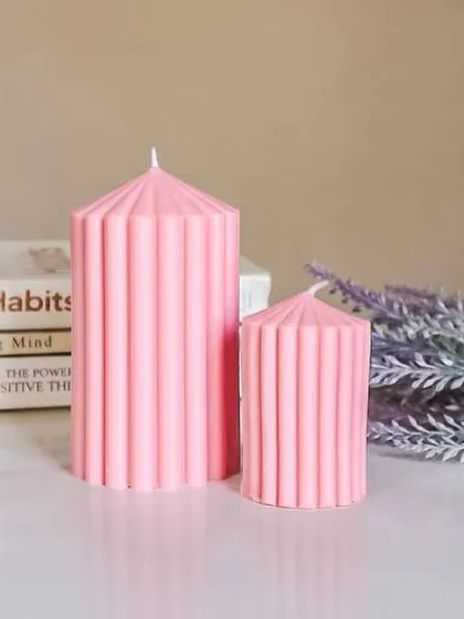 Simple and chic, these ribbed pillar candles come in two sizes. Their clean lines work well with minimalist and contemporary decor styles.