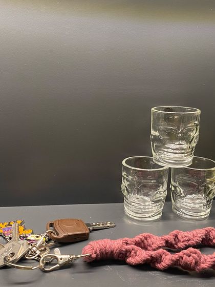 My macrame wristlet keychain on a table, showing its texture and how it keeps your keys easy to find.