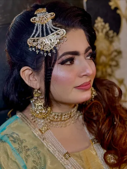 A close-up of a Pakistani-inspired look from a portfolio shoot, focusing on the jhoomar and heavy jewellery.