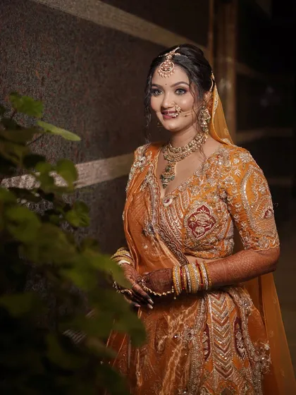 A beautiful portrait of the bride in an outdoor setting, looking fresh and vibrant.