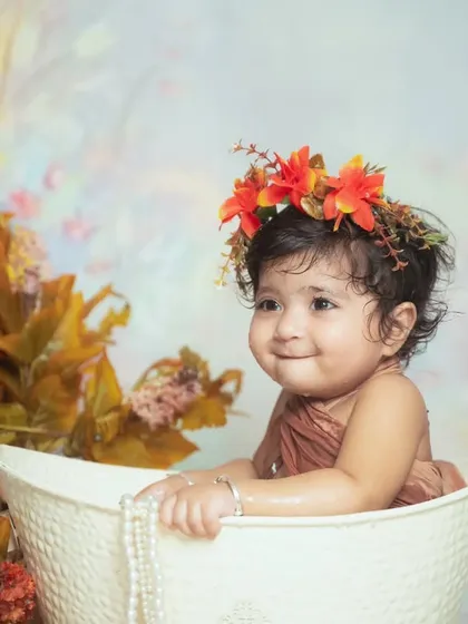 Our water splash sessions are pure fun. We create a safe and playful environment to capture your baby's delightful expressions as they play.