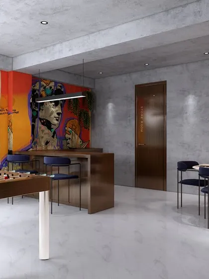 In the cafeteria of our Gurgaon office project, we used vibrant graffiti art to break the monotony. The space includes a foosball table and a bar, creating a fun and relaxing recreational area.