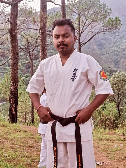 As a Sensei, I lead by example. This was taken during our summer camp, a moment of focus before training begins. My goal is to guide every student on their martial arts journey with discipline and care.