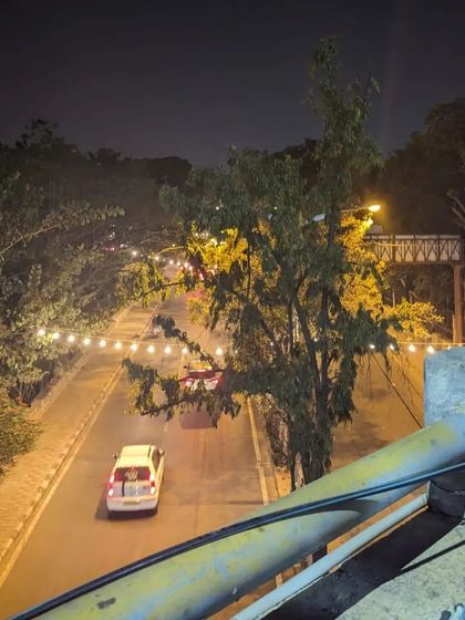 An overhead view of a quiet, decorated street in Indiranagar during our Republic Day ride. Seeing the city from different perspectives is a highlight of our journeys.