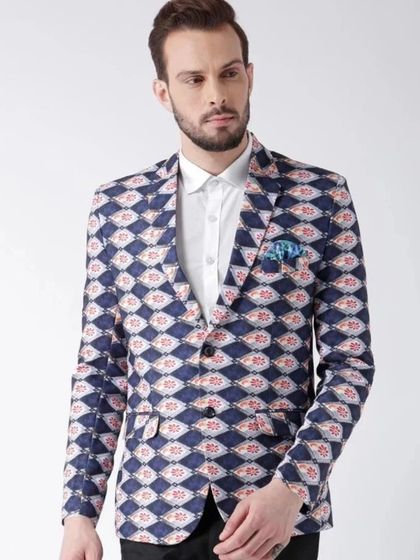 A printed formal blazer in blue and red. This is another example of a statement jacket that can elevate a simple formal outfit, perfect for festive occasions.