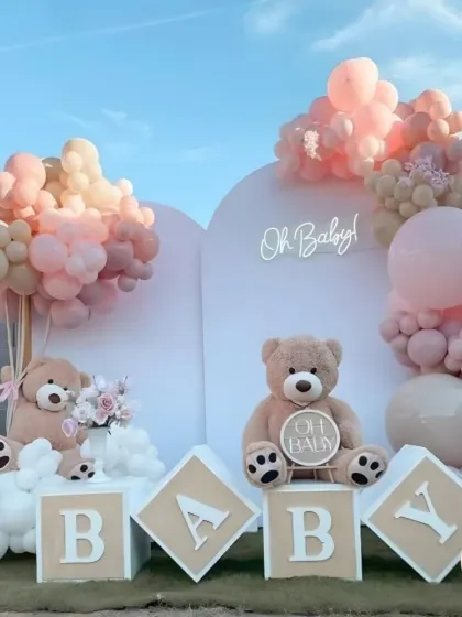 This elegant outdoor baby shower was designed with a soft, neutral palette. The 'Oh Baby' theme included adorable teddy bears, custom 'BABY' blocks, and beautiful balloon arrangements, creating a serene and picture-perfect setting for the parents-to-be.