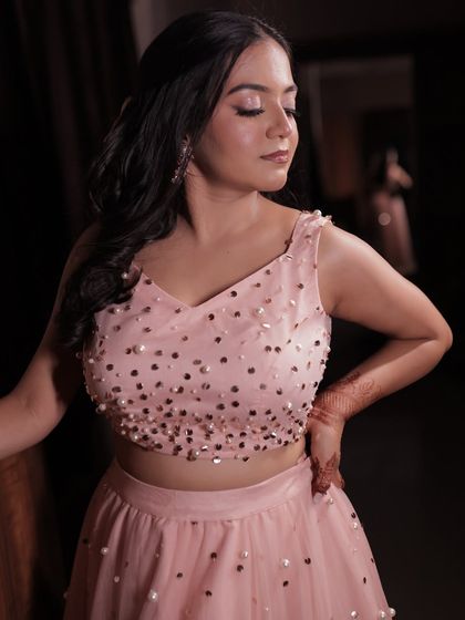 A close-up of the soft pink makeup look. The shimmery eyeshadow and glowing skin are perfect for a romantic evening event.