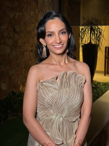 This client is the picture of modern sophistication, ready for her evening event. The makeup is subtle yet impactful, creating a polished and timeless look.