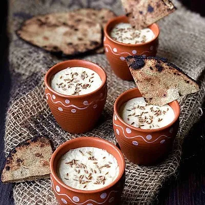 Our Bajre ki Raab served in traditional kulhads with pieces of flatbread. This wholesome and nutritious millet soup is a comforting taste of Rajasthan's culinary heritage.