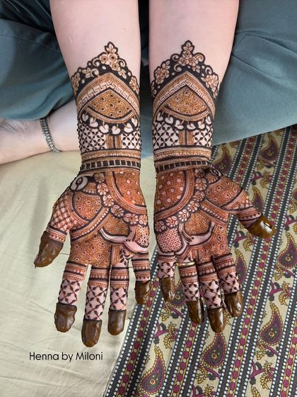 A beautiful bridal design with a mix of paisleys, checks, and floral patterns, creating a rich and varied texture.