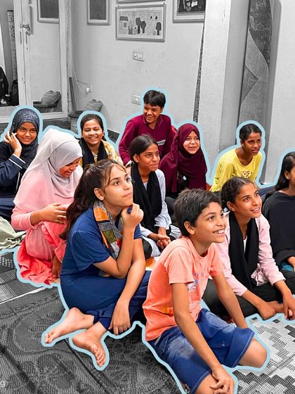 The bright, engaged faces of students during a music session. Their attentive expressions show how captivating and joyful learning can be in a safe and supportive environment.