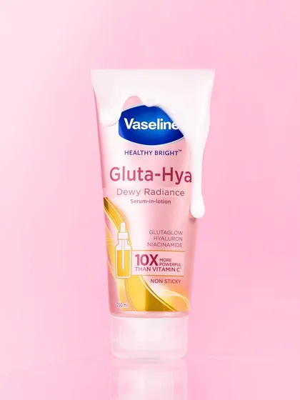 To showcase the dewy, radiant finish of Vaseline's Gluta-Hya serum, I styled the shot with a creamy product drip. The simple pink background keeps the focus entirely on the product and its texture.