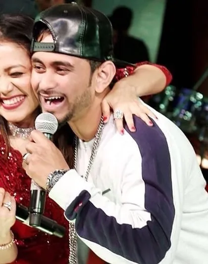 Sharing a laugh on stage with the incredible Neha Kakkar. As a live concert host, my goal is to create these moments of genuine connection between the artist and the audience, making the show unforgettable.