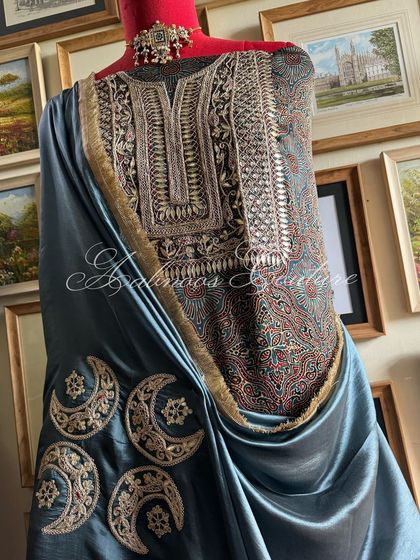 A full view of the styled ensemble on a mannequin, demonstrating its regal and contemporary aesthetic.