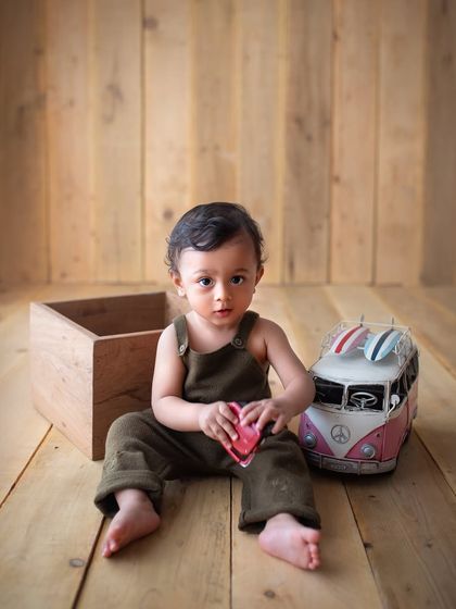 This little guy is ready for an adventure with his toy van. I love incorporating simple toys as props in toddler sessions.