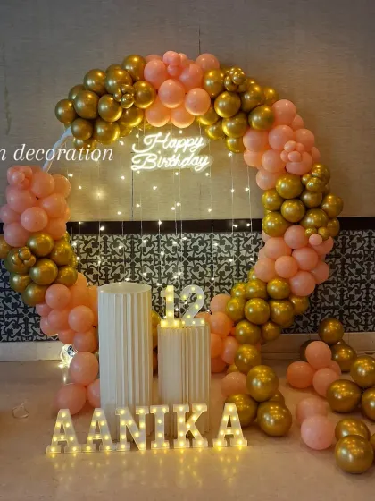 A centered shot of the peach and gold birthday decoration, perfect for a pre-teen's celebration.
