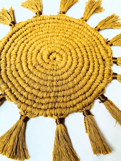 This angled close-up highlights the craftsmanship of the knots and the texture of the tassels. It shows how the piece adds a three-dimensional, tactile quality to your decor.