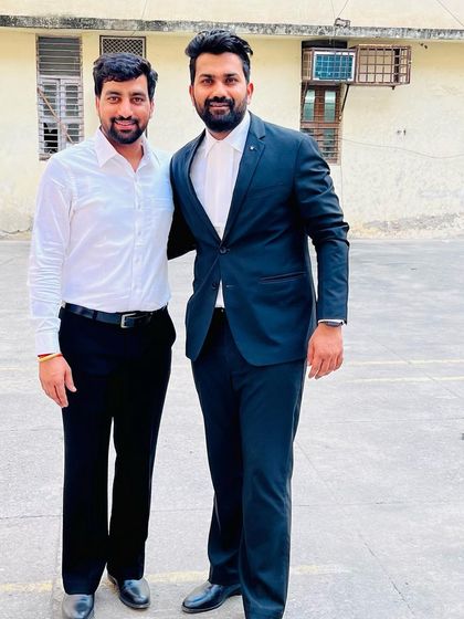 Standing with a colleague outside the court. Lawyers are indeed a pillar of society, responsible for upholding the rule of law.