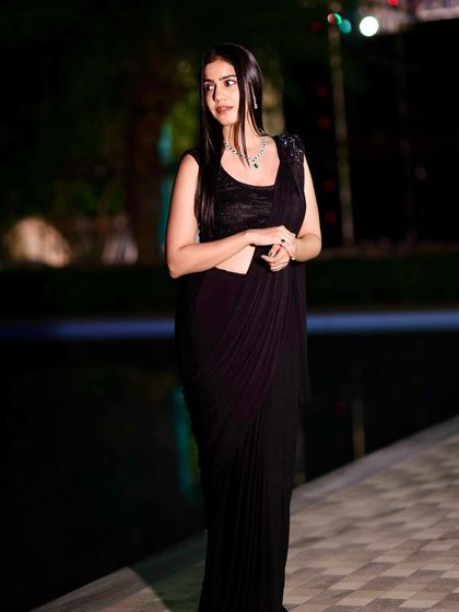 A classic black saree is always a winner. This look is timeless, elegant, and perfect for any formal evening affair.