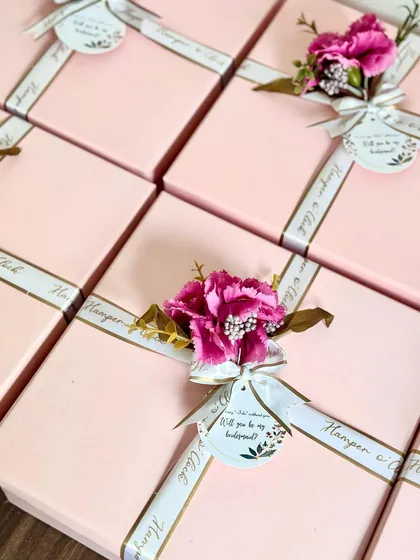 For a truly luxurious bridesmaid proposal, these exquisite hampers are packed with a complete skincare range and high-end products, all presented in a beautifully decorated box.