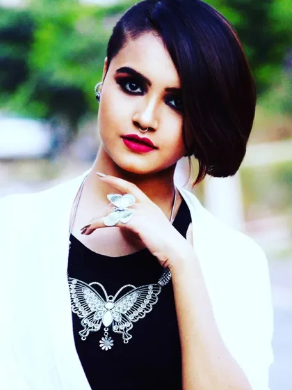 This is an example of my creative and edgy work for photoshoots. The look features a dramatic smokey eye, a bold red lip, and an asymmetrical haircut, showing my versatility for clients who want a unique, high fashion look.