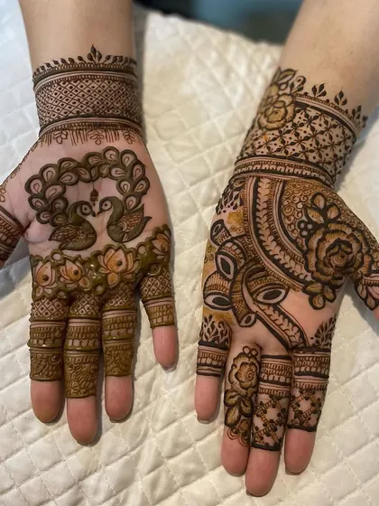 A unique Karwa Chauth design, with peacocks on one hand and a portrait-style motif on the other. I enjoy creating personalized designs that tell a story.