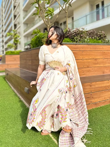 A side profile, enjoying the sun. This is a perfect, comfortable, and chic saree look for a day out.