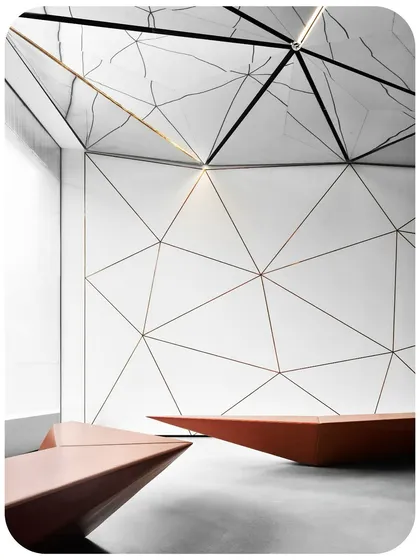 A close-up of the bespoke angular seating elements, which integrate with the lobby's geometric narrative. The triangulated pattern on the wall, inlaid with rose-gold, complements the ceiling's dynamic form.