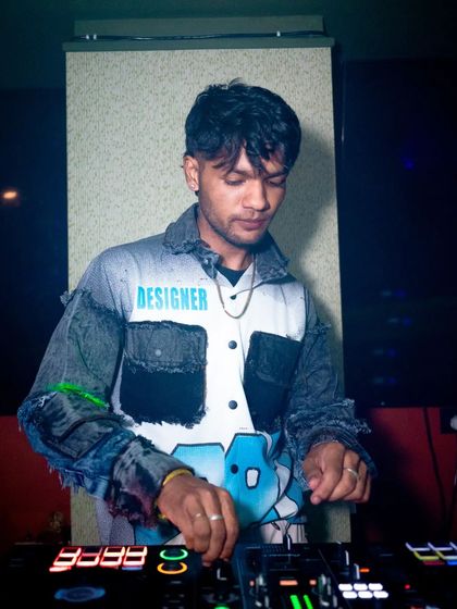 Another angle of me mixing, with cool lighting on my designer jacket.