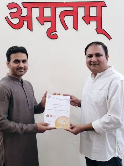 A student is awarded his 200-hour YTTC certificate. It is wonderful to see more people embracing the call to teach yoga.