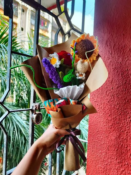 The same floral bouquet, held up against the window. The natural light shows off all the different colors and textures.