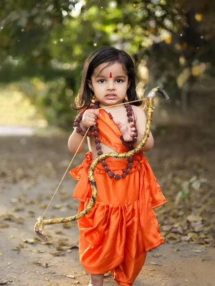 A powerful and adorable portrait of a little girl as Ram, ready with her bow. These images are a small step to help future generations connect with our stories.