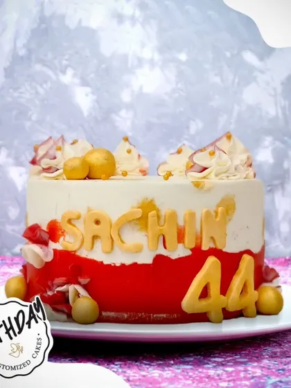 A golden delight for Sachin's 44th birthday. This custom cake with red and gold accents is a stylish and celebratory choice for a milestone.