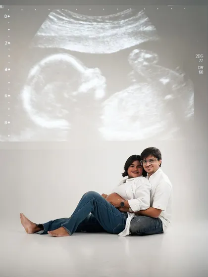 Let's get creative with your announcement. Here, we projected the baby's first picture, the sonogram, to create a unique and deeply personal portrait for the parents-to-be.